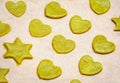 Raw homemade cookies with green tea matcha in star shape and heart shape on baking sheet Royalty Free Stock Photo