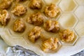 Raw homemade dumplings. Chicken meat with spices on the dough. The process of making dumplings Royalty Free Stock Photo