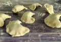 Raw homemade dumplings with potatoes on a wooden table close-up. Dough product. Close up Royalty Free Stock Photo