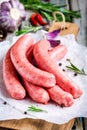 Raw homemade sausages on cutting board Royalty Free Stock Photo