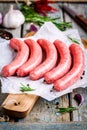 Raw homemade sausages on cutting board Royalty Free Stock Photo