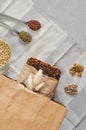 Raw homemade vegan sourdough bread made of green buckwheat with flax seeds, sunflower, pumpkin in a paper Kraft bag. Healthy and Royalty Free Stock Photo