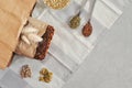 Raw homemade vegan sourdough bread made of green buckwheat with flax seeds, sunflower, pumpkin in a paper Kraft bag. Healthy and Royalty Free Stock Photo