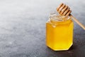 Raw honey in a jar on black table Royalty Free Stock Photo