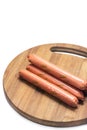 Raw hot dogs on the cutting wooden board Royalty Free Stock Photo