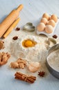 Raw igredients for cake eggs, spices, flour. Baking background. Kitchen gray table with bakery supplies