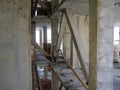 A raw, industrial view of a building's concrete skeleton under construction, showing beams and pillars. Royalty Free Stock Photo