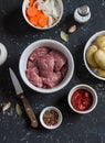 Raw ingredients - beef, potatoes, onions, carrots, tomato sauce Royalty Free Stock Photo