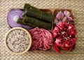 Raw ingredients for cooking dolma. Grape leaves, beef and pomegranate.