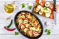 Raw ingredients for traditional French casserole, ratatouille to