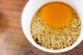 raw instant noodle in cup add egg Royalty Free Stock Photo