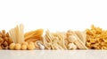 Raw italian pasta, collection of different pasta kinds, set of dry fusilli, conchiglio, farfalle and penne isolated on Royalty Free Stock Photo