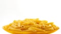 Raw italian penne rigate pasta on white background