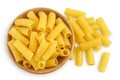 raw italian Rigatoni pasta in wooden bowl isolated on white background with clipping path and full depth of field. Top Royalty Free Stock Photo