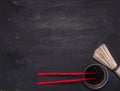 Raw Japanese buckwheat noodles with soy sauce and red chopsticks place for text,frame wooden rustic background top view