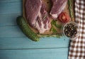 Raw juicy meat steaks ready for roasting on a wooden background Royalty Free Stock Photo