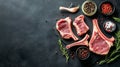 Raw lamb chops and fresh mutton cutlets on ribs displayed on dark surface with ample copy space Royalty Free Stock Photo