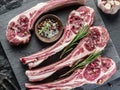 Raw lamb chops with garlic and herbs. Royalty Free Stock Photo