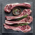 Raw lamb chops with garlic and herbs.