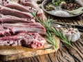 Raw lamb chops with garlic and herbs. Royalty Free Stock Photo