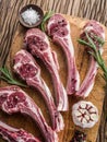 Raw lamb chops with garlic and herbs. Royalty Free Stock Photo