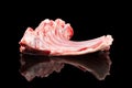 Raw lamb chops isolated on a black background. Raw fresh rack of lamb isolated. Lamb Ribs Raw Meat Isolated over black Royalty Free Stock Photo
