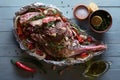 Raw lamb leg, marinated with herbs Royalty Free Stock Photo