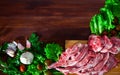 Raw lamb meat with vegetables on wooden background Royalty Free Stock Photo