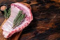 Raw lamb mutton ribs with herbs on wooden board. Wooden background. Top view. Copy space Royalty Free Stock Photo