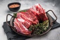 Raw lamb Riblets, fresh mutton meat with rib bone. grey background. top view Royalty Free Stock Photo