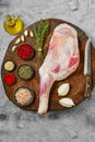 Raw lamb shoulder on butcher`s cutting log Royalty Free Stock Photo