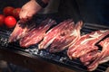 raw lamb steaks on a big grill barbecue Royalty Free Stock Photo