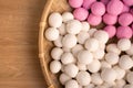 Raw little tangyuan in a sieve over wooden table Royalty Free Stock Photo