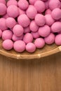 Raw little tangyuan in a sieve over wooden table Royalty Free Stock Photo