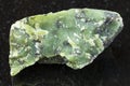 raw Lizardite stone on dark background