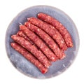 Raw longaniza from minced pork on plate. Popular Catalan sort of sausages