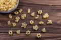 Raw macaroni on an old wooden table. Mix pasta. Close up Royalty Free Stock Photo