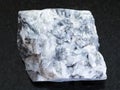 Raw magnesite stone on dark background