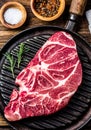 Raw marbled beef steak on grill pan Royalty Free Stock Photo