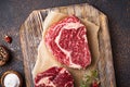 Raw marbled ribeye steak and spices Royalty Free Stock Photo