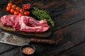Raw Marbled sirloin Beef Steaks, on old dark wooden table background, with copy space for text
