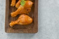 Raw marinated chicken drumsticks with grey background Royalty Free Stock Photo