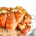 Raw marinated pork roll sprinkled with spices and tied with string. Lying on foil. Royalty Free Stock Photo