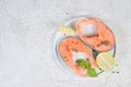 Raw marinated red fish in spices, lime and olive oil in a white plate. Top view, copy space Royalty Free Stock Photo