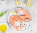 Raw marinated red fish in spices, lime and olive oil in a white plate. Top view Royalty Free Stock Photo