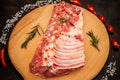 Raw marinated ribs. black background, view from above, close-up Royalty Free Stock Photo