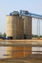 Raw material warehouse and a conveyor belt in a cement factory