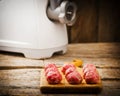 Raw meat balls on a chopping board. Royalty Free Stock Photo