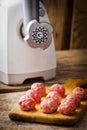 Raw meat balls on a chopping board. Royalty Free Stock Photo