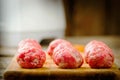 Raw meat balls on a chopping board. Royalty Free Stock Photo